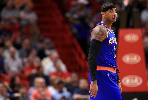 Carmelo Anthony #7 of the New York Knicks looks on during a game against the Miami Heat at American Airlines Arena on December 6, 2016 in Miami, Florida.