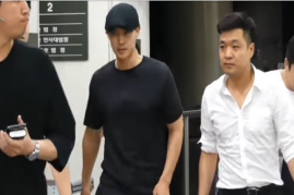 Kim Hyun Joong leaving court after a hearing in July.