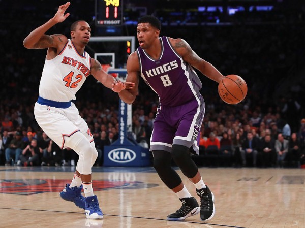 Sacramento Kings small forward Rudy Gay (R) dribbles against New York Knicks' Lance Thomas