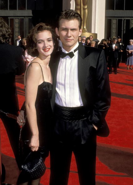 Winona Ryder and Christian Slater posed for a photo together.