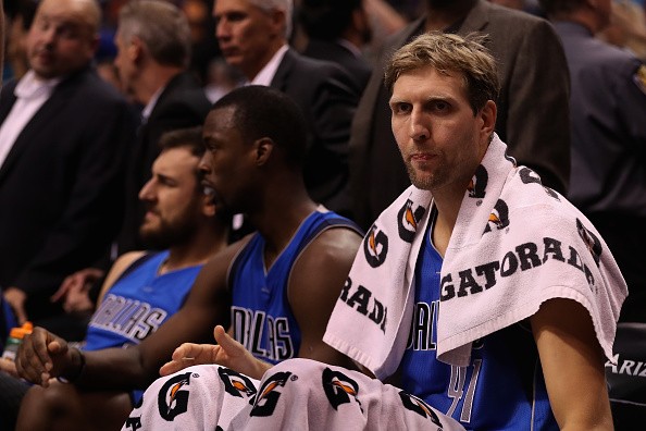 Dirk Nowitzki #41 of the Dallas Mavericks sits on the bench during the first half of the preseason NBA game against the Phoenix Suns at Talking Stick Resort Arena on October 14, 2016 in Phoenix, Arizona. 