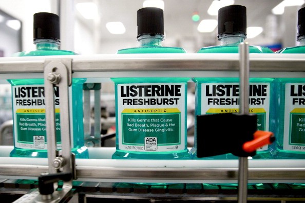 Johnson & Johnson (J&J) Listerine brand freshburst mouthwash bottles move through the production line on a conveyor at the J&J consumer healthcare products plant in Lititz, Pennsylvania, U.S., on Wednesday, June 18, 2014.