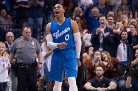 Oklahoma City Thunder guard Russell Westbrook #0 reacts after the Thunder scored against the Minnesota Timberwolves during the second half of a NBA game at the Chesapeake Energy Arena on December 25, 2016 in Oklahoma City, Oklahoma. 