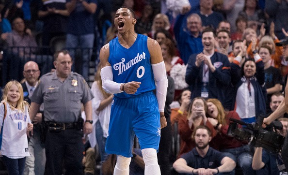 Oklahoma City Thunder guard Russell Westbrook #0 reacts after the Thunder scored against the Minnesota Timberwolves during the second half of a NBA game at the Chesapeake Energy Arena on December 25, 2016 in Oklahoma City, Oklahoma. 