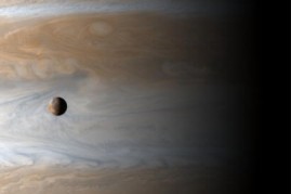 Gliding past the planet Jupiter, the Cassini spacecraft captures this awe inspiring view of active Io, Jupiter's third largest satellite, with the largest gas giant as a backdrop, offering a stunning demonstration of the ruling planet's relative size, Apr