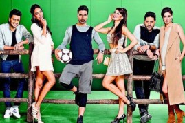 'Housefull 3' first look poster,  featuing Akshay Kumar, Riteish Deshmukh, Lisa Haydon, Abhishek Bachchan, Nargis Fakhri and Jacqueline Fernandez leaning against a wooden fence alongside a green background