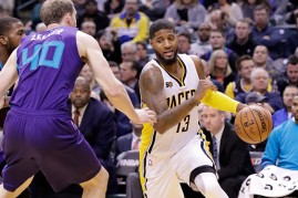 Paul George #13 of the Indiana Pacers dribbles the ball during the game against the Charlotte Hornets at Bankers Life Fieldhouse on December 12, 2016 in Indianapolis, Indiana.