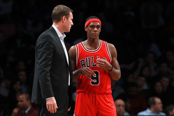 Head coach Fred Hoiberg and Rajon Rondo #9 of the Chicago Bulls talk on the sideline during the second half at Barclays Center on October 31, 2016 in New York City.  