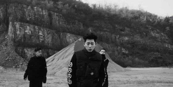 BLOCK B's Zico in the official music video of "BERMUDA TRIANGLE" featuring Crush and DEAN.