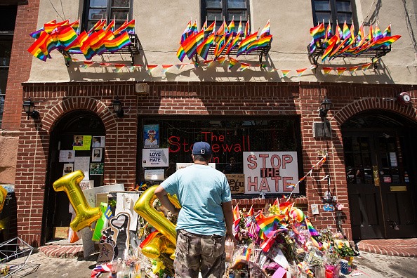  A man stops in front of the Stonewall Inn on June 24, 2016 in New York City. President Barack Obama designated Stonewall Inn and approximately 7.7 acres surrounding it as the first national monument dedicated 'to tell the story of the struggle for LGBT r