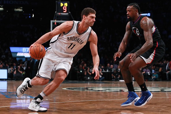 Brook Lopez #11 of the Brooklyn Nets drives to the basket against DeAndre Jordan #6 of the Los Angeles Clippersin the first half at Barclays Center on November 29, 2016 in the Brooklyn borough of New York City. 
