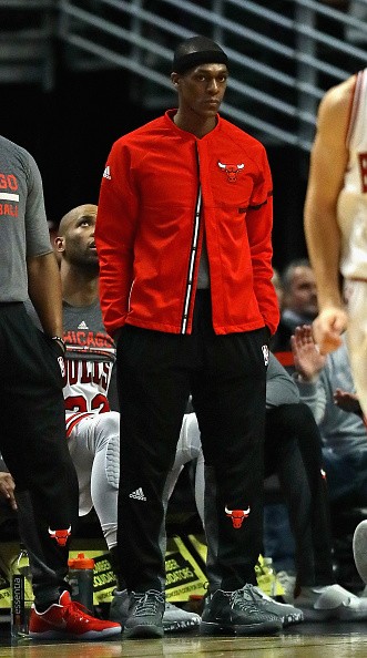 Rajon Rondo #9 of the Chicago Bulls watches from the bench as the Bulls take on the Charlotte Hornets at the United Center on January 2, 2017 in Chicago, Illinois. 