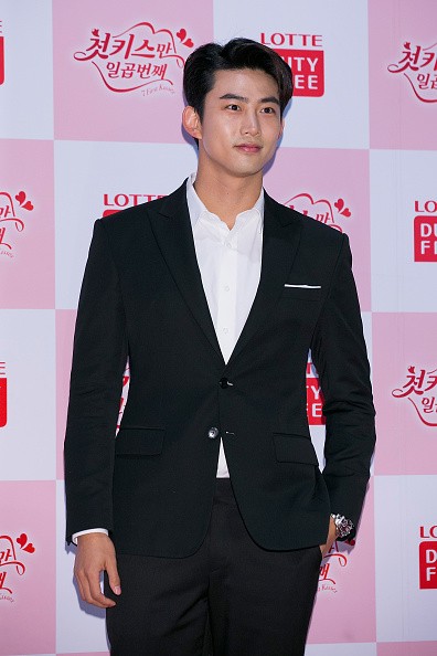 2PM member Taecyeon smiles for the camera during the press conference for Lotte Duty Free - Web Drama '7 First Kisses'.
