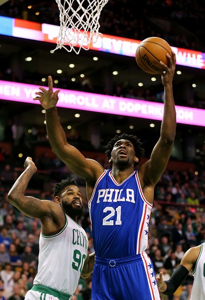 Joel Embiid #21 of the Philadelphia 76ers takes a shot over Amir Johnson #90 of the Boston Celtics during the first half at TD Garden on January 6, 2017 in Boston, Massachusetts.