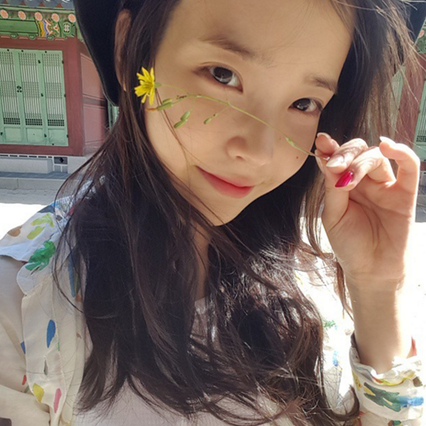 Born Lee Ji-eun, IU plays the lead female role Hae-soo in the SBS drama series "Moon Lovers."
