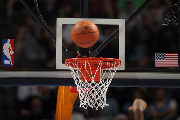 A detail photo of the ball as it falls through the rim as the Denver Nuggets face the New York Knicks at the Pepsi Center on November 16, 2010 in Denver, Colorado.