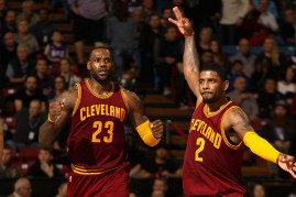 Cleveland Cavaliers players LeBron James (L) and Kyrie Irving