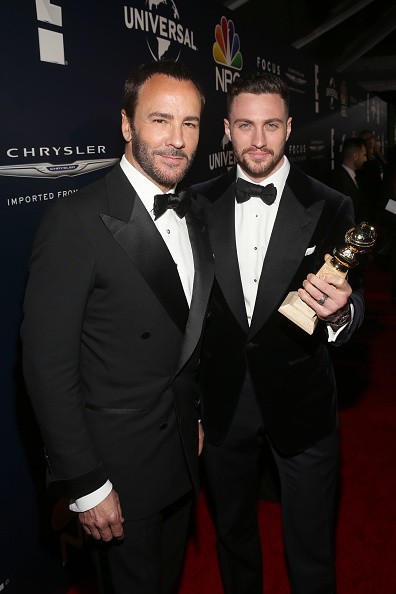 Director Tom Ford (L) and actor Aaron Taylor-Johnson, winner of Best Supporting Actor in a Motion Picture for 'Nocturnal Animals'.