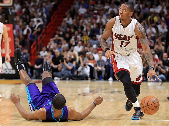 Rodney McGruder #17 of the Miami Heat picks up a loose ball during a game against the Charlotte Hornets at American Airlines Arena on October 28, 2016 in Miami, Florida. 