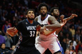 Clippers center DeAndre Jordan (middle) battles for the rebound with the Wolves' Karl-Anthony Towns (L) and Andrew Wiggins