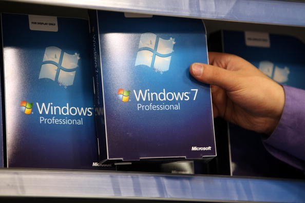 A computer store employee stacks copies of Microsoft's new operating system 'Windows 7' ahead of its official launch at midnight tonight on October 21, 2009 in London, England.