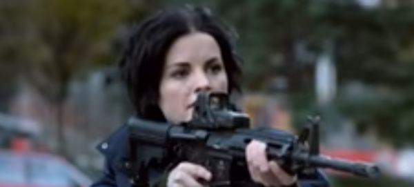 Jane points a gun at someone in a scene from "Blindspot" Season 2 episode 13, "Named Not One Man."