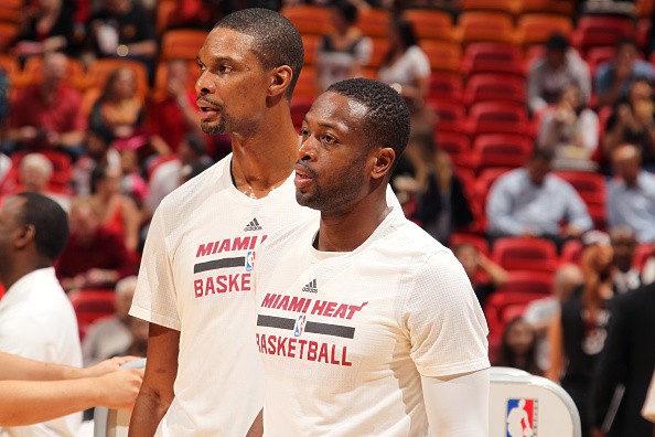 Dwyane Wade #3 and Chris Bosh #1 of the Miami Heat warm up before the game against the Washington Wizards on December 7, 2015 at American Airlines Arena in Minneapolis, Florida. 