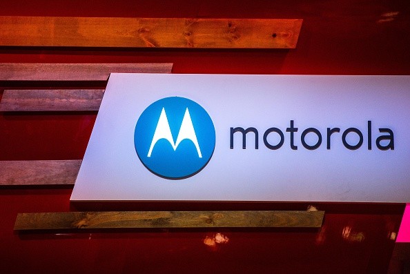 A logo sits illuminated outside the Motorola pavilion during the second day of the Mobile World Congress 2015 at the Fira Gran Via complex on March 3, 2015 in Barcelona, Spain