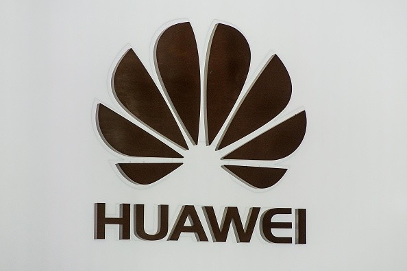 A logo sits illuminated outside the Huawei pavilion on the opening day of the World Mobile Congress at the Fira Gran Via Complex on February 22, 2016 in Barcelona, Spain. 