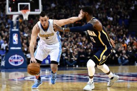 Danilo Gallinari of the Denver Nuggets holds of Paul George of the Indiana Pacers during the NBA match between Indiana Pacers and Denver Nugget in London, England.