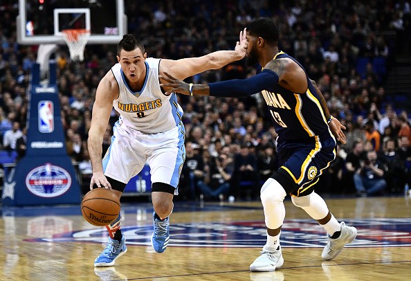Danilo Gallinari of the Denver Nuggets holds of Paul George of the Indiana Pacers during the NBA match between Indiana Pacers and Denver Nugget in London, England.