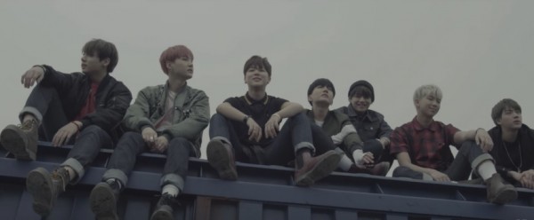 BTS in the official music video of "I NEED U."