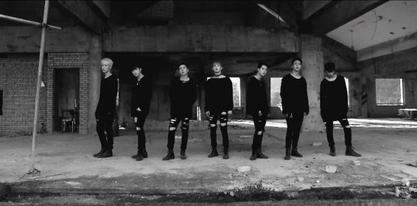 MONSTA X members in the official music video of "Stuck."