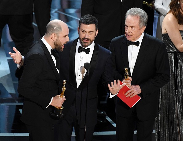The “La La Land” producer Jordan Horowitz on the left announces that “Moonlight” is the Oscars Best Picture winner. Horowitz is with the host Jimmy Kimmel, in the middle and with the actor Warren Beatty on the right.