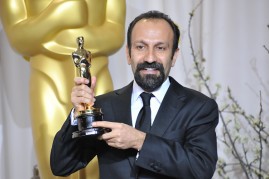  The image features Filmmaker Asghar Farhadi as he holds the “84th Annual Academy Awards” Best Foreign Film Award for “A Separation”.