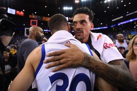 Matt Barnes hugs Stephen Curry after the end of 2015-16 regular season on April 23, 2016.
