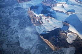 Ice floats near the coast of West Antarctica as seen from a window of a NASA Operation IceBridge airplane on October 27, 2016 in-flight over Antarctica.