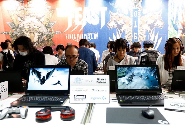 Visitors play the Final Fantasy XIV in the Square Enix Co. booth at Tokyo Game Show on Sept, 17, 2016 in Chiba, Japan. 