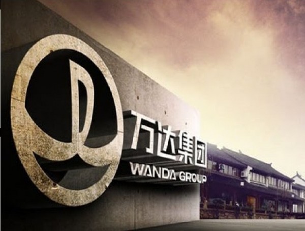 The official logo of Dalian Wanda Group standing outside of its main office.
