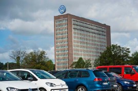 Office Builiding of Volkswagen AG headquarters seen behind VW employees car park on August 09, 2016 in Wolfsburg, Germany.