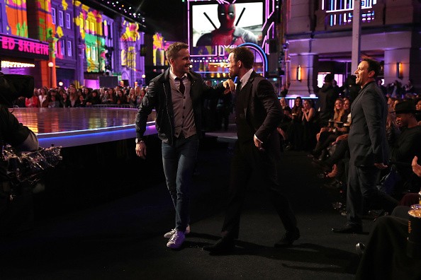 Actors Ryan Reynolds and Ed Skrein and fight coordinator Philip J Silvera, winners of Best Fight for 'Deadpool,' walk onstage during the 2016 MTV Movie Awards at Warner Bros. Studios on April 9, 2016 in Burbank, California. 