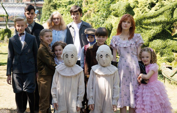 The peculiar children from "Miss Perigrine's Home for Peculiar Children" poses for a group photo.