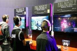 Visitors play a video game 'Final Fantasy XV' at the Paris Game Week, a trade fair for video games on October 28, 2015 in Paris, France.