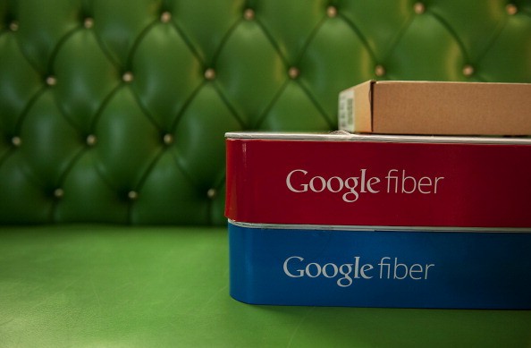 Boxes of equipment needed to install Google Fiber broadband network sit on a couch at the home of customer Becki Sherwood in Kansas City, Kansas, U.S., on Tuesday, Nov. 27, 2012. 