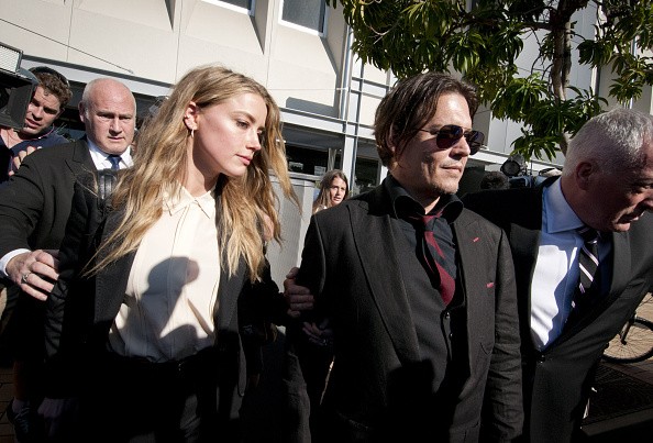 Model, Amber Heard, and her husband, Johnny Depp, leave Southport Magistrates Court, Queensland, April 18, 2016.