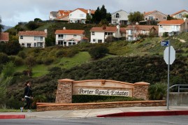 Eunice Kim passes the intersection of Hollow Springs Dr. and Tampa Ave while walking back to her home February 18, 2016 in Porter Ranch, California.