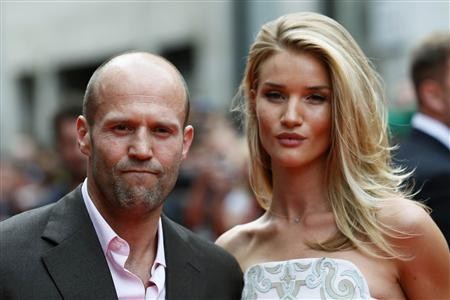 Actor Jason Statham arrives with his girlfriend Rosie Huntington-Whiteley for the world premiere of ''Hummingbird'', at Leicester Square in central London June 17, 2013. 