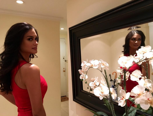 Filipino beauty queen Pia Alonzo Wurtzbach takes a break during her first day at work as Miss Universe 2015.