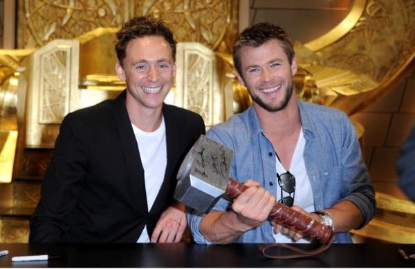 Actors Tom Hiddleston and Chris Hemsworth signed autographs during Comic-Con 2010 on July 24, 2010 in San Diego, California.