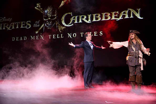 Walt Disney Studios Motion Picture Production President Sean Bailey and Johnny Depp as Captain Jack Sparrow, of 'Pirates of the Caribbean: Dead Men Tell No Tales' are seen on stage at the 'Worlds, Galaxies, and Universes: Live Action at The Walt Disney St